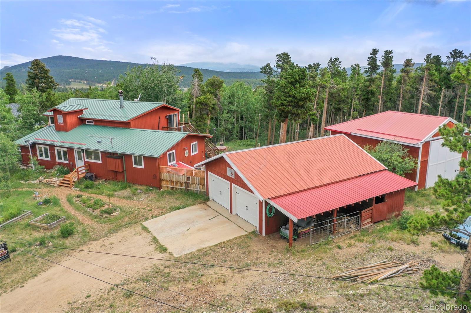 an aerial view of a house with a big yard