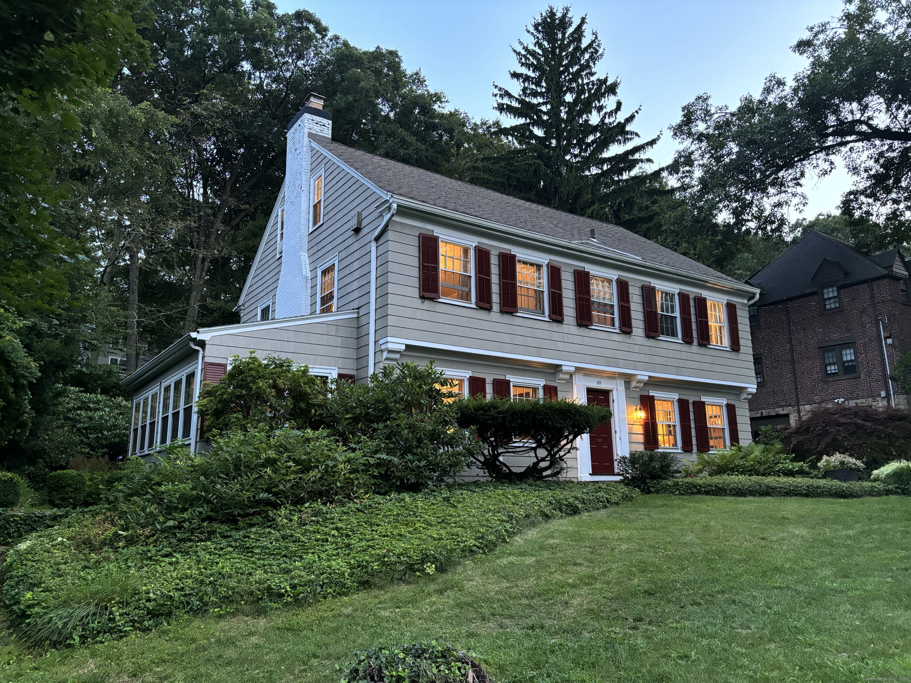 a front view of a house with garden