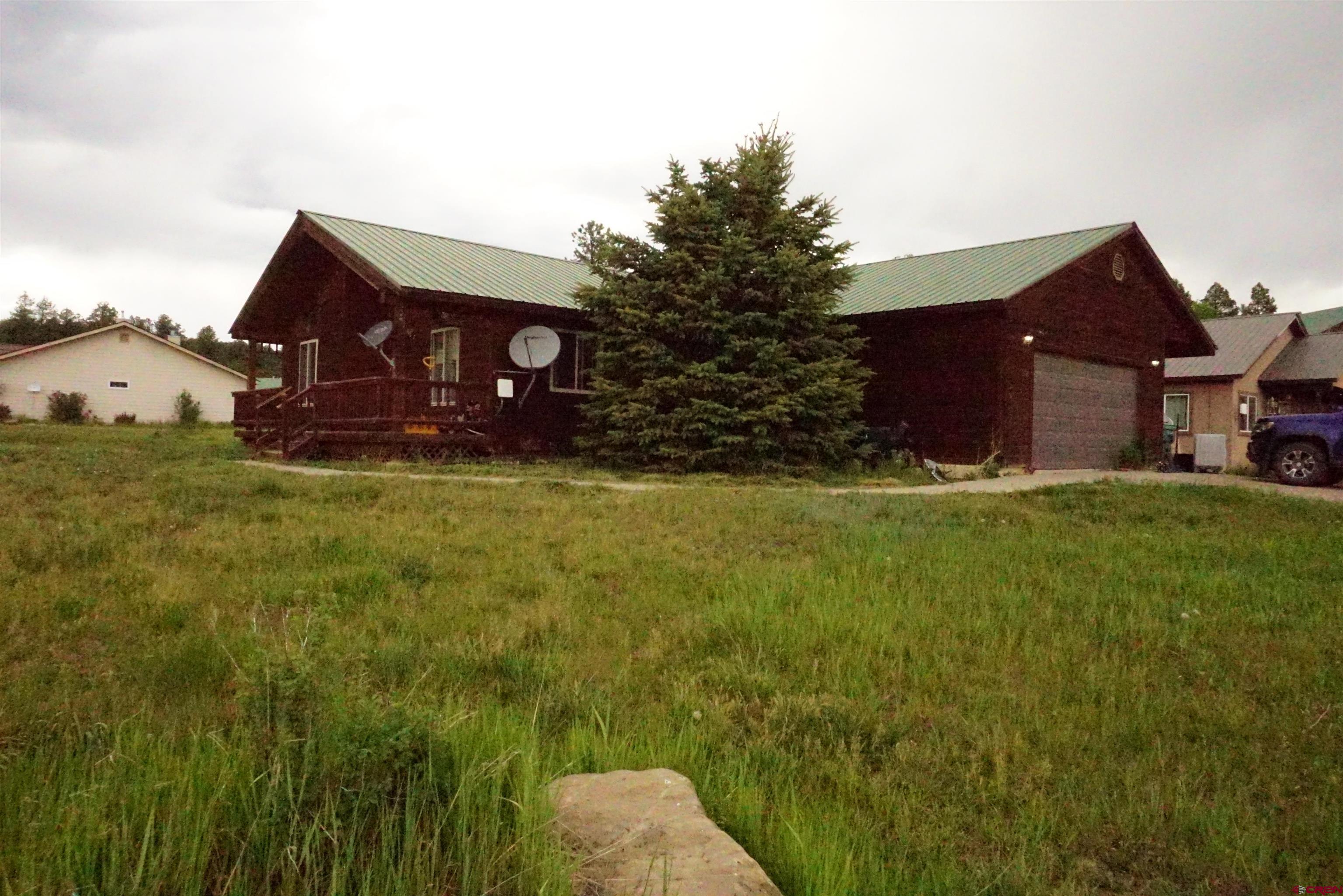 a view of a house with a big yard