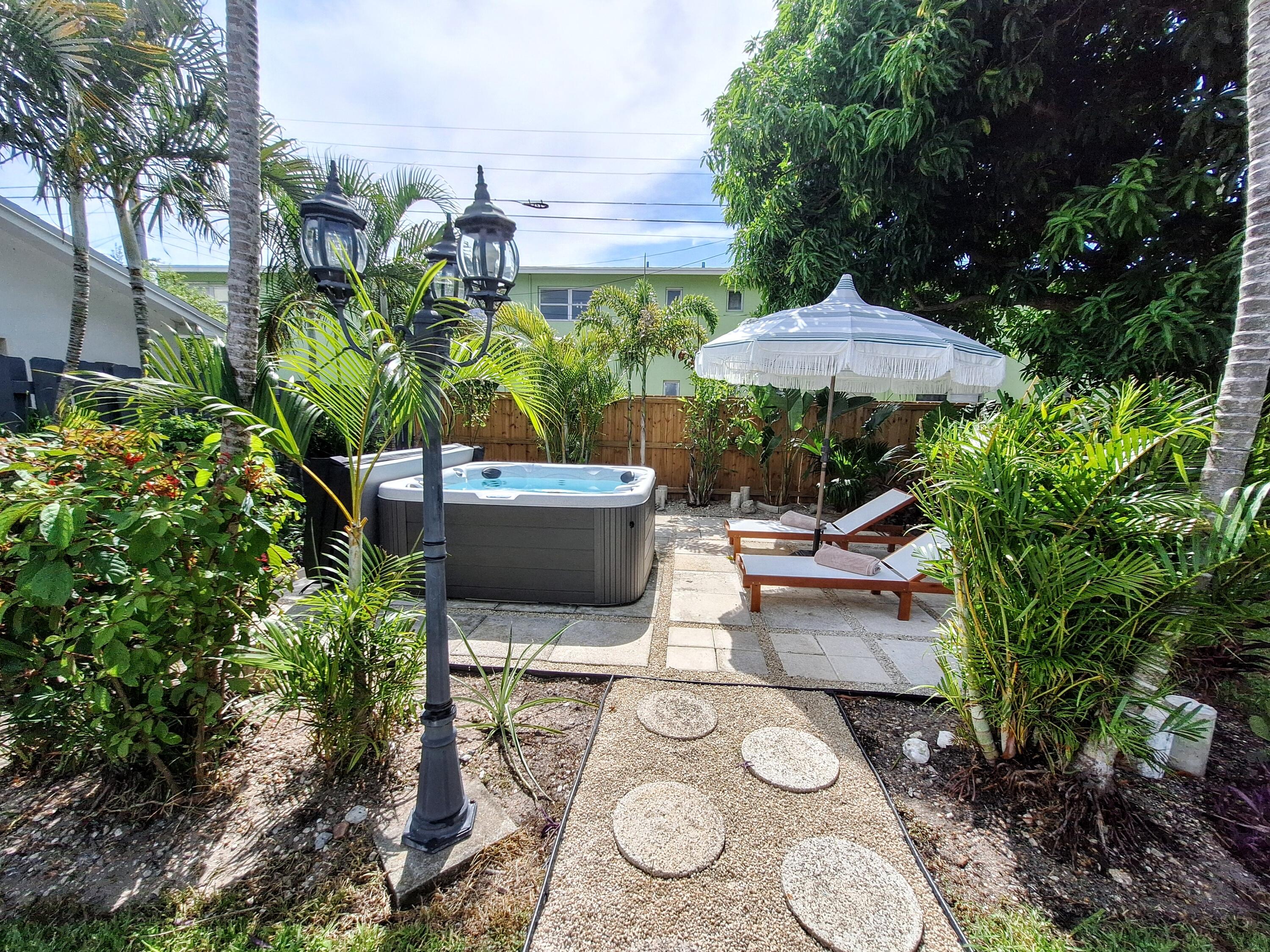 a view of a backyard with sitting area and furniture