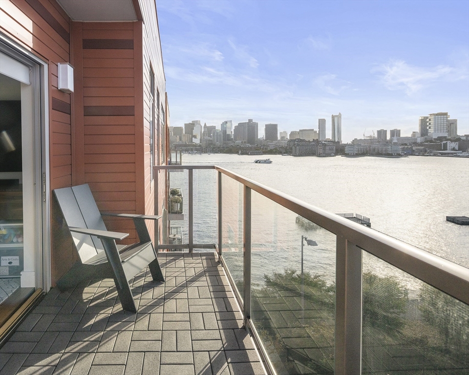 a view of a balcony with chairs