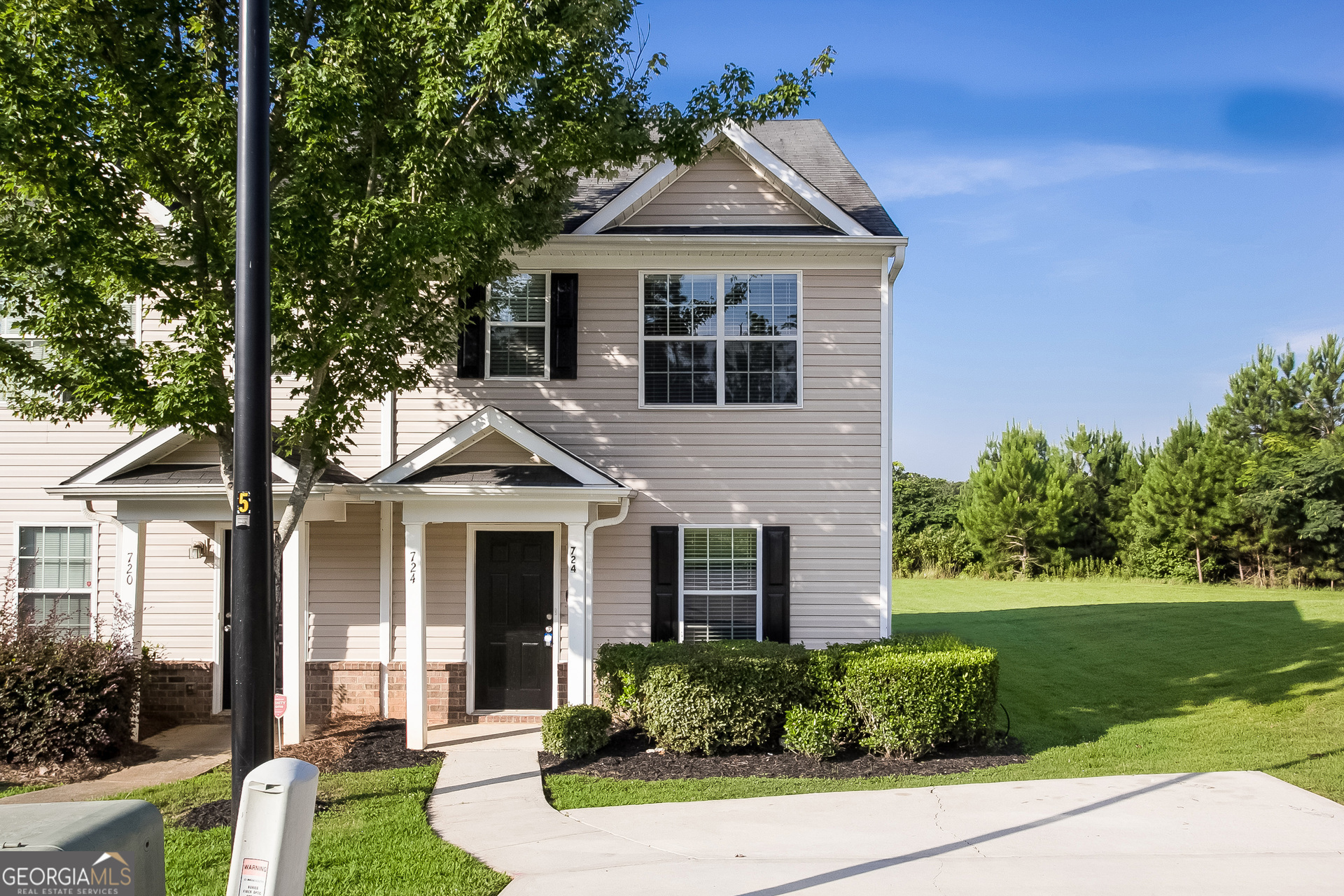 front view of a house with a yard