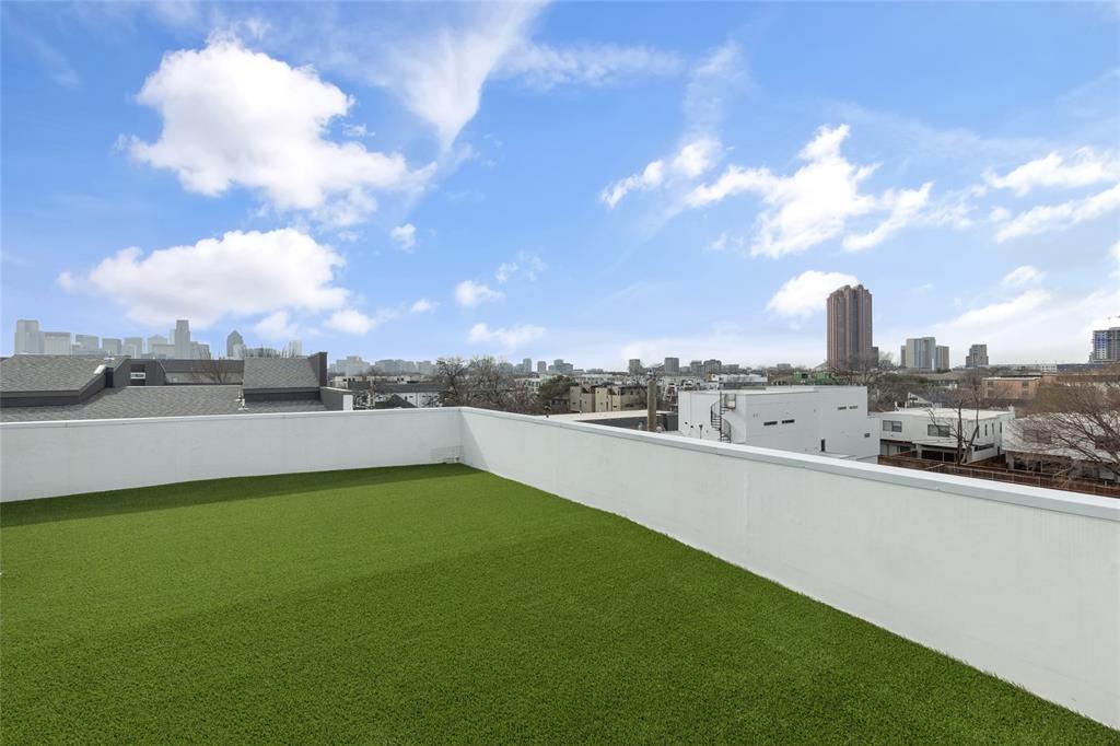 a view of a terrace with yard and lake view