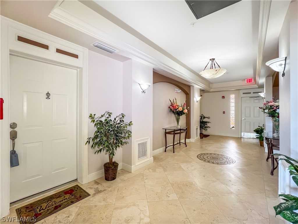 a view of a entryway door and living room