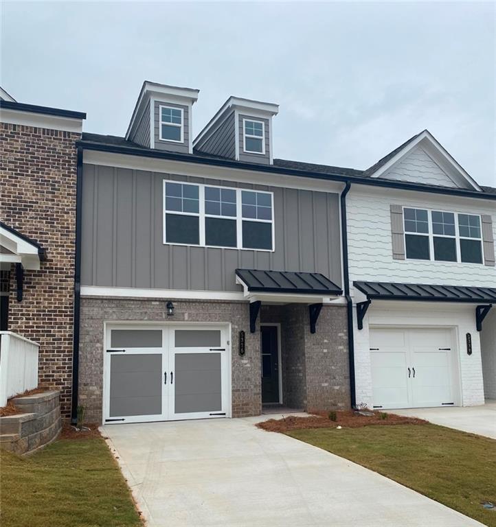 a front view of a house with a garage