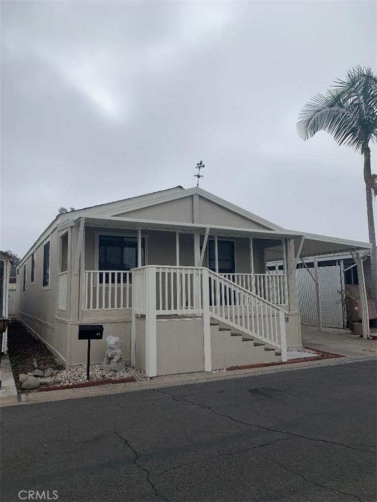 a front view of a house with a porch