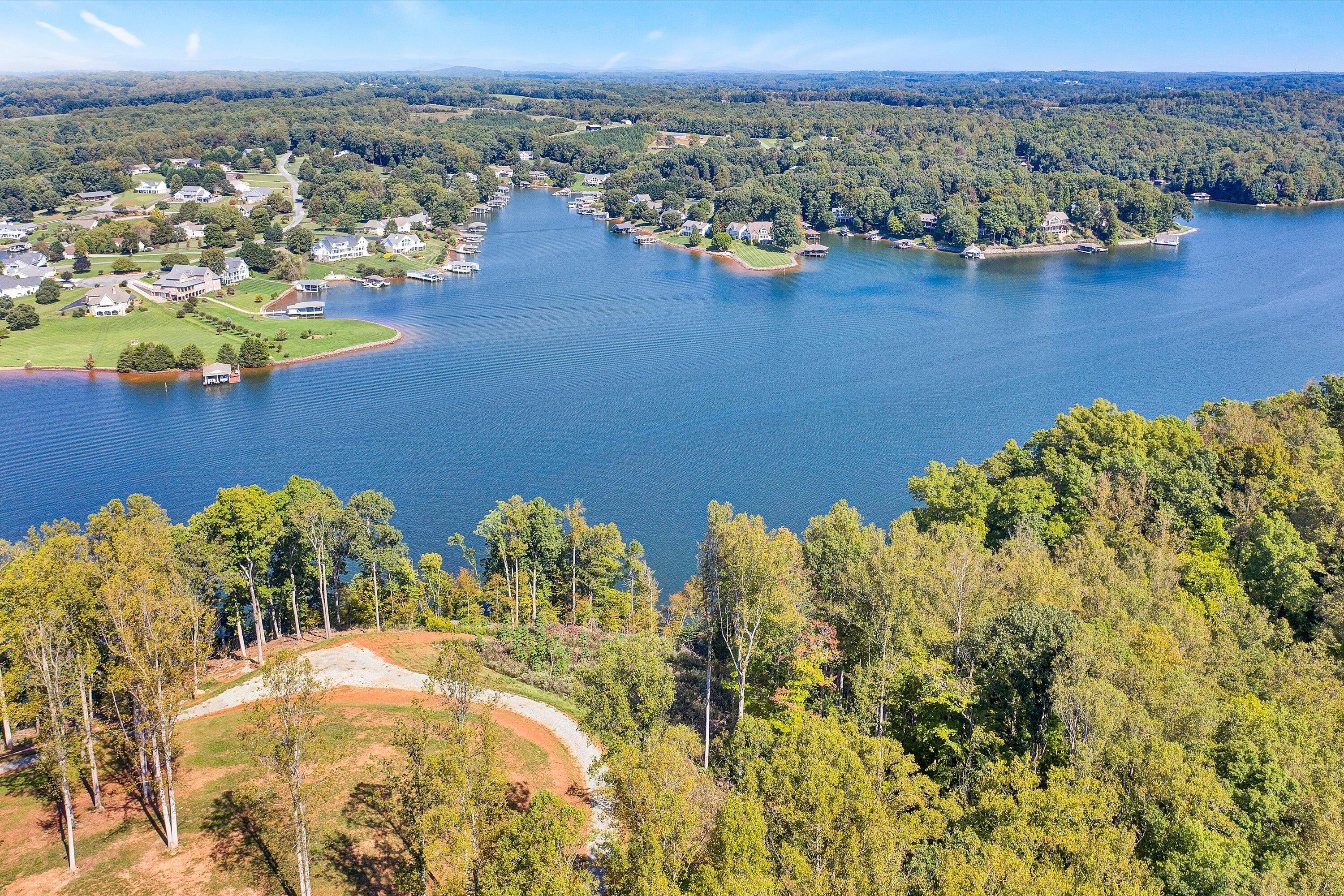 an aerial view of a house with a lake view