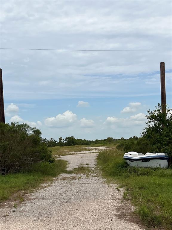 a view of a lake with a yard