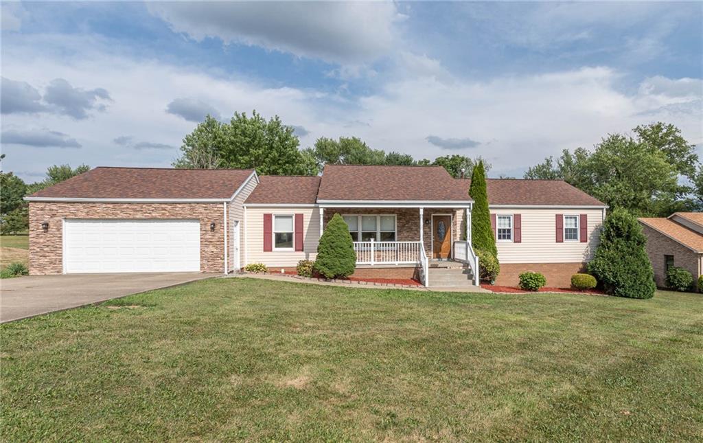 front view of a house with a big yard