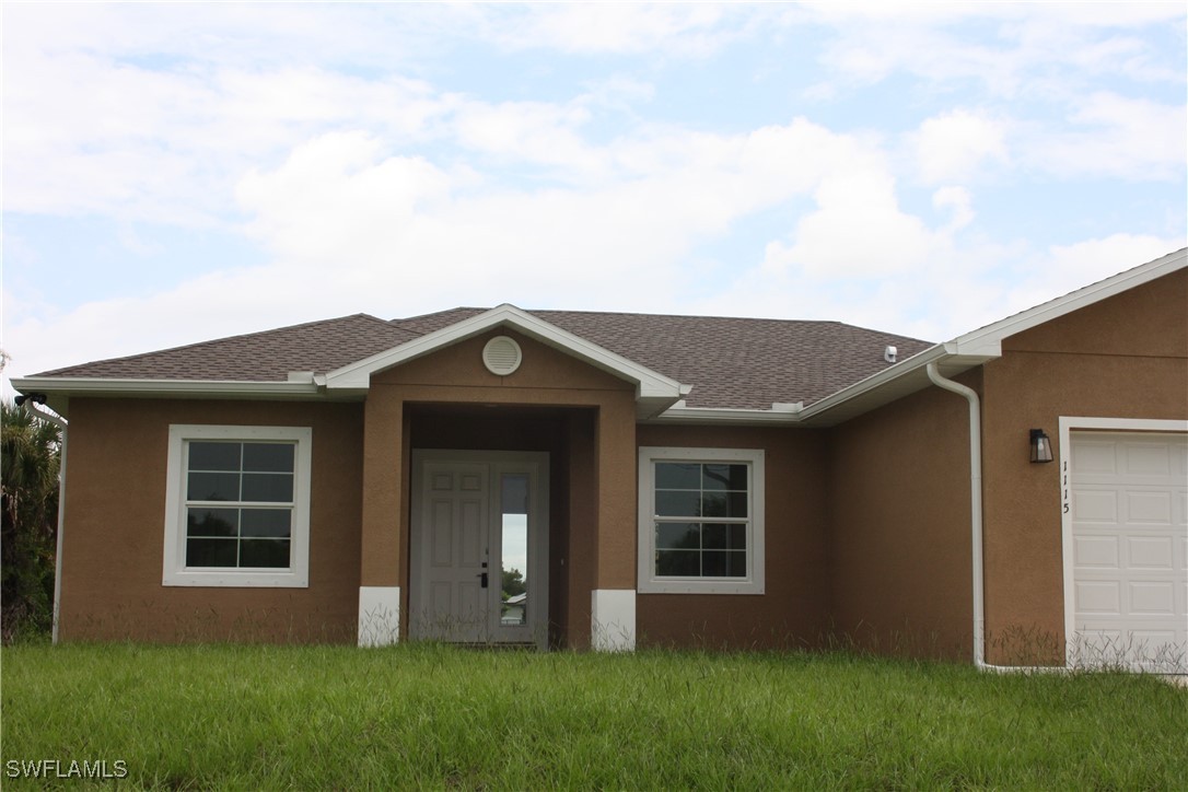 front view of a house with a yard