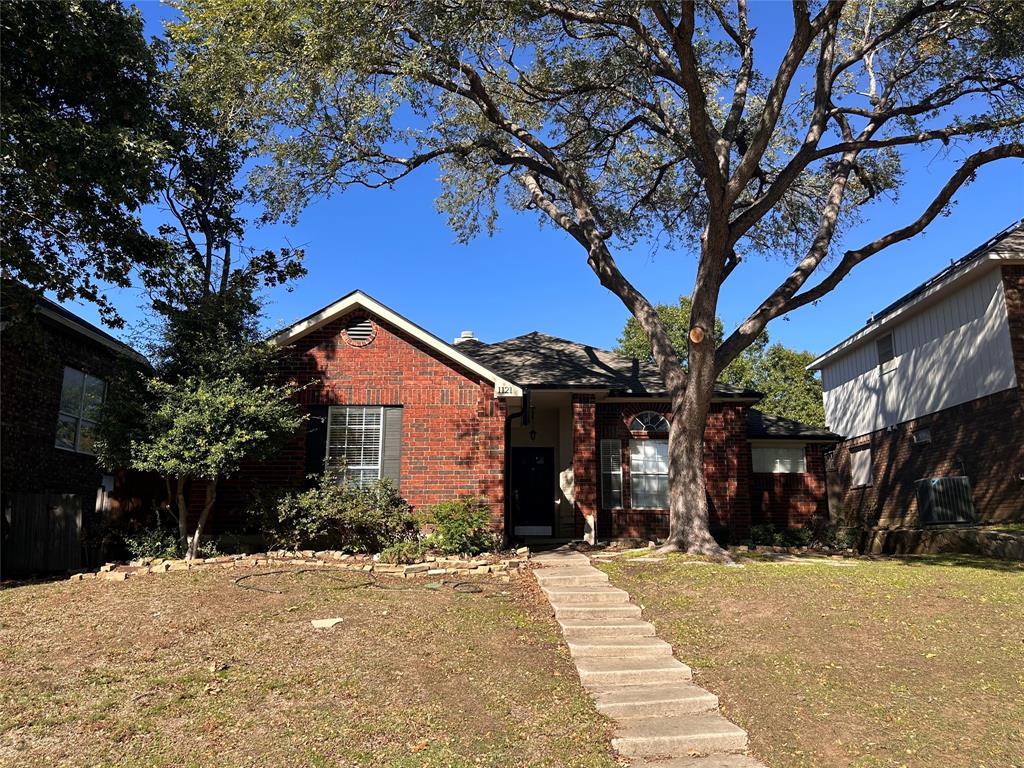 a house with a tree in front of it