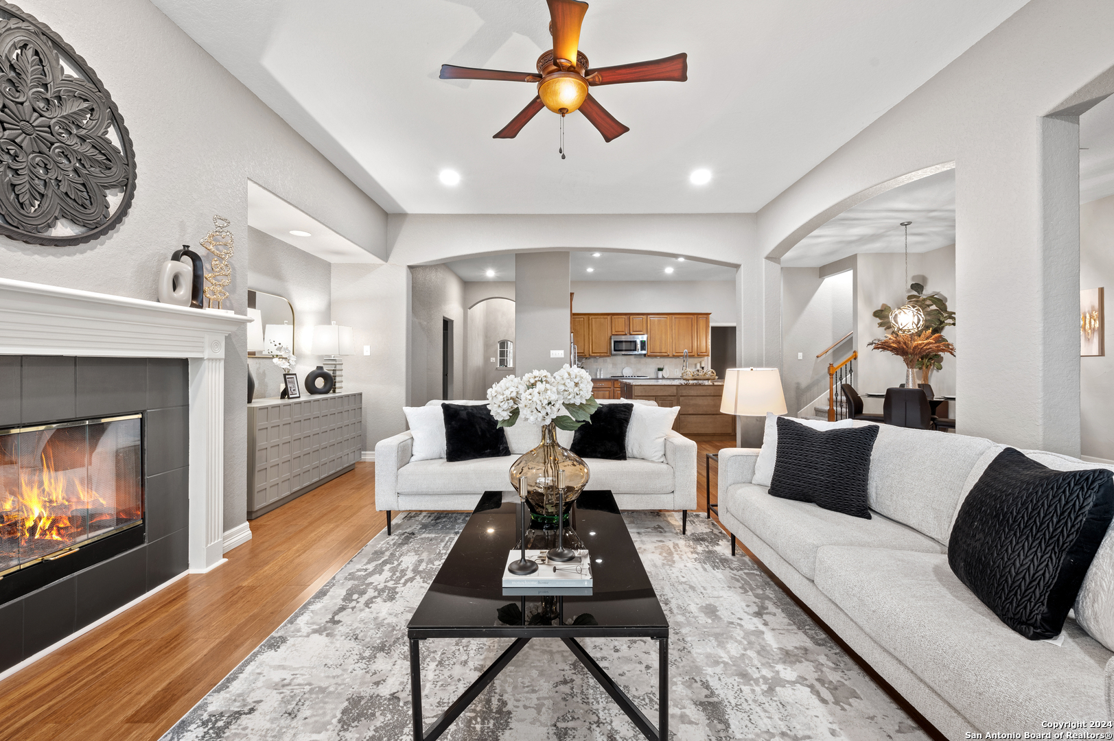 a living room with furniture and a fireplace