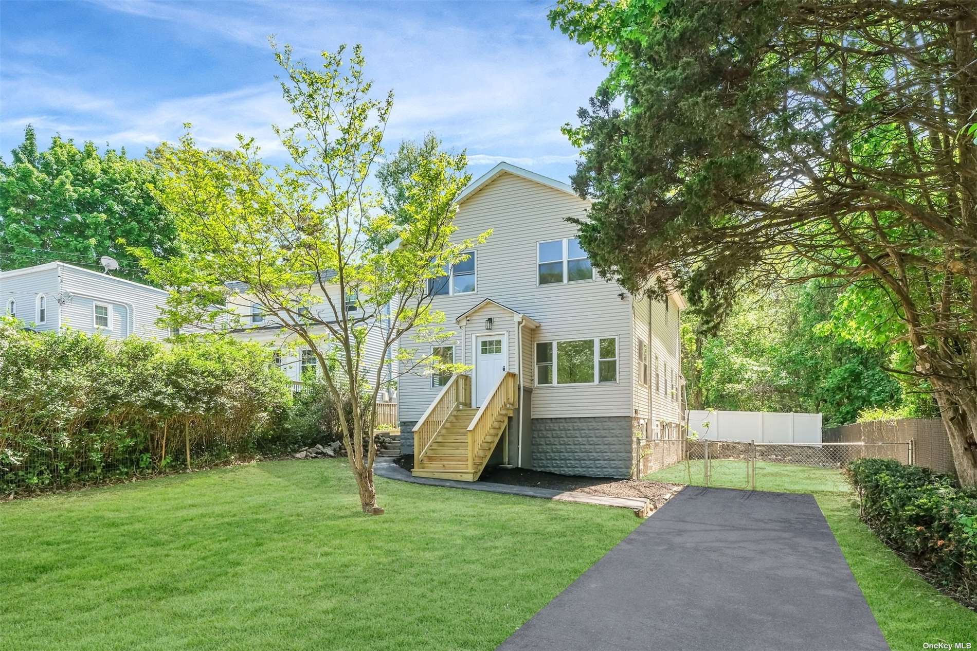 a view of house with a yard