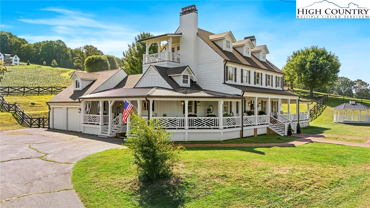 a front view of house with a garden