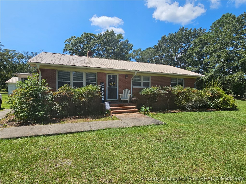 front view of a house with a yard