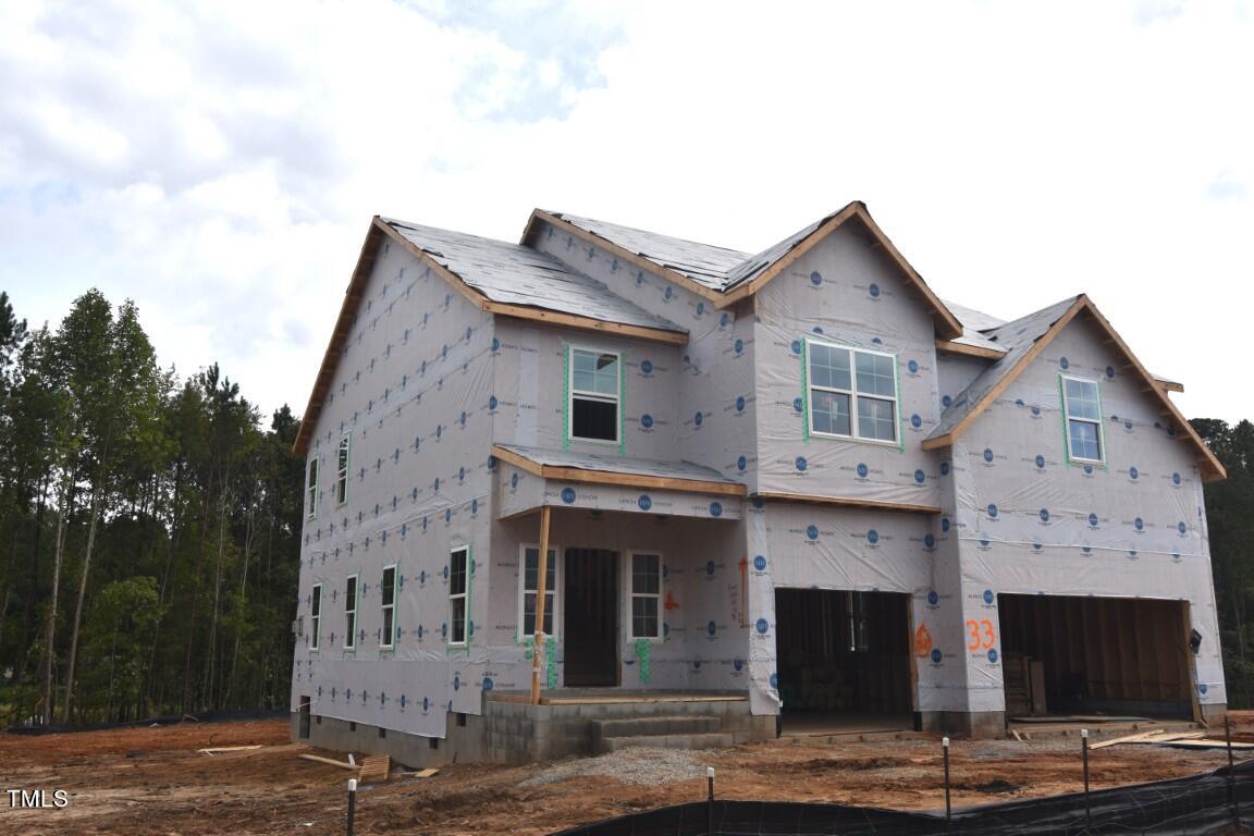 a front view of a house with white walls