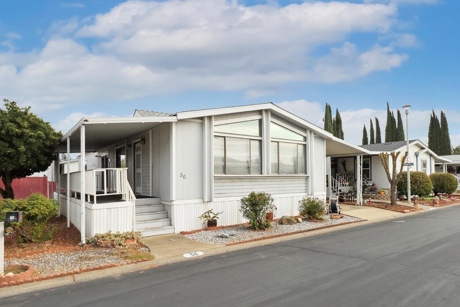 a front view of a house with garage