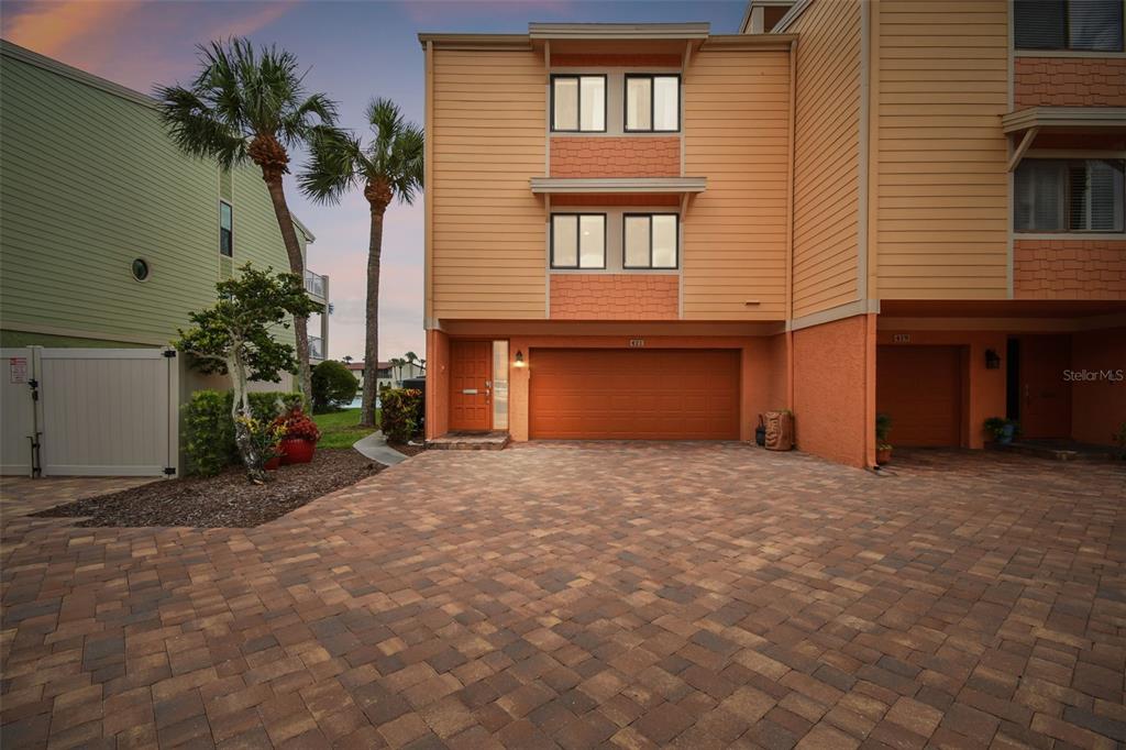 a view of a house with a yard and garage