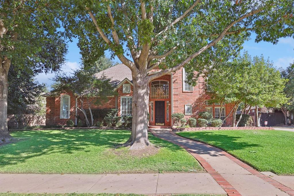 a house with garden in front of it