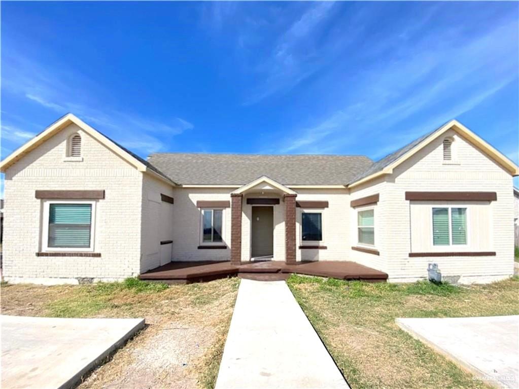 front view of a house with a yard