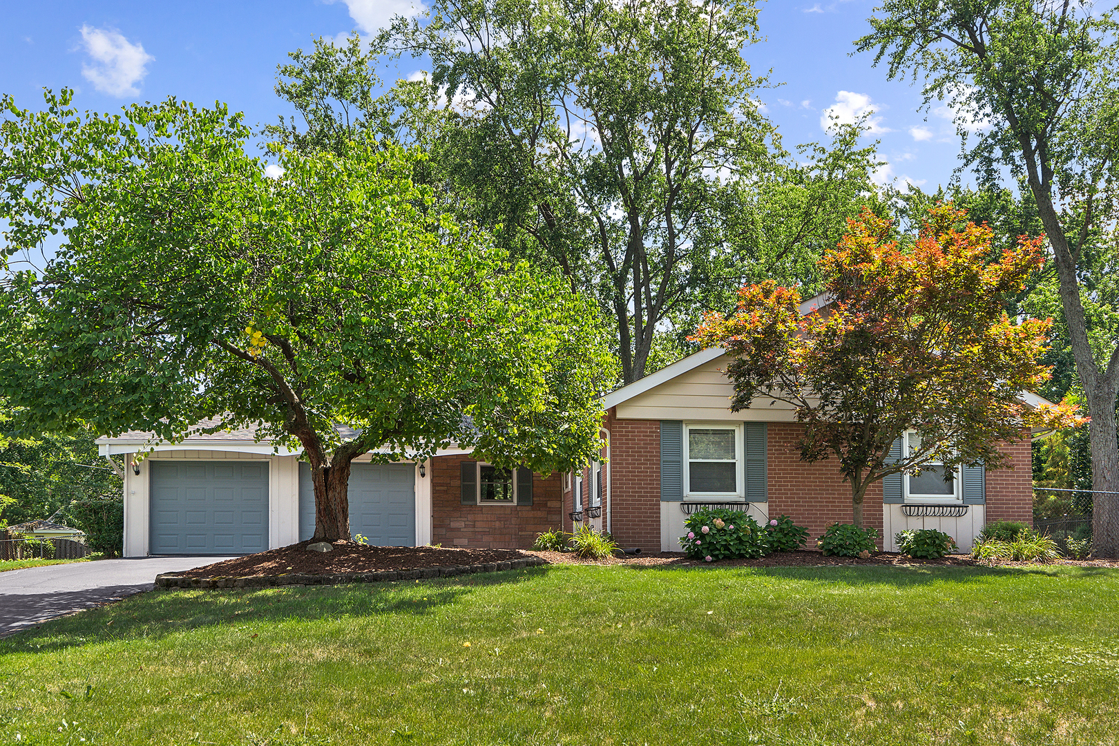 front view of a house with a yard