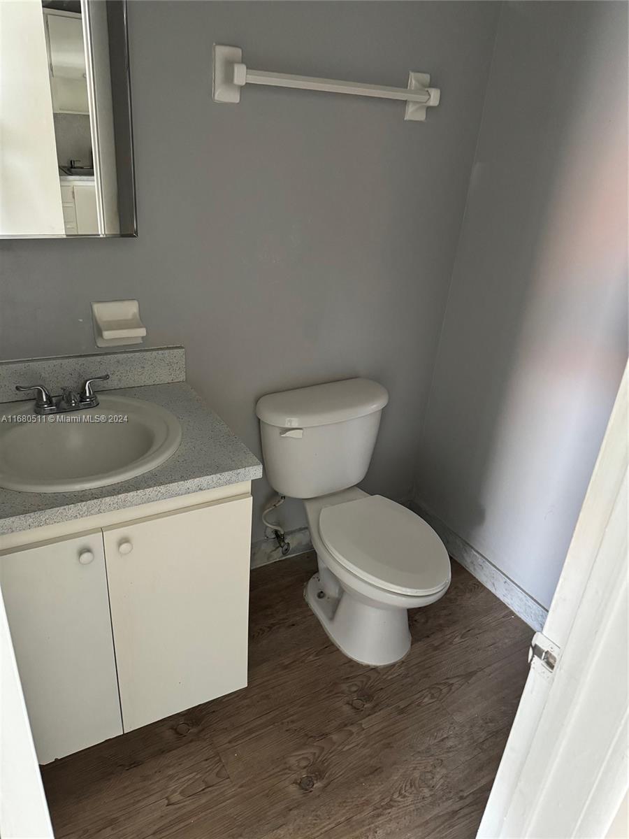 a bathroom with a toilet and a sink