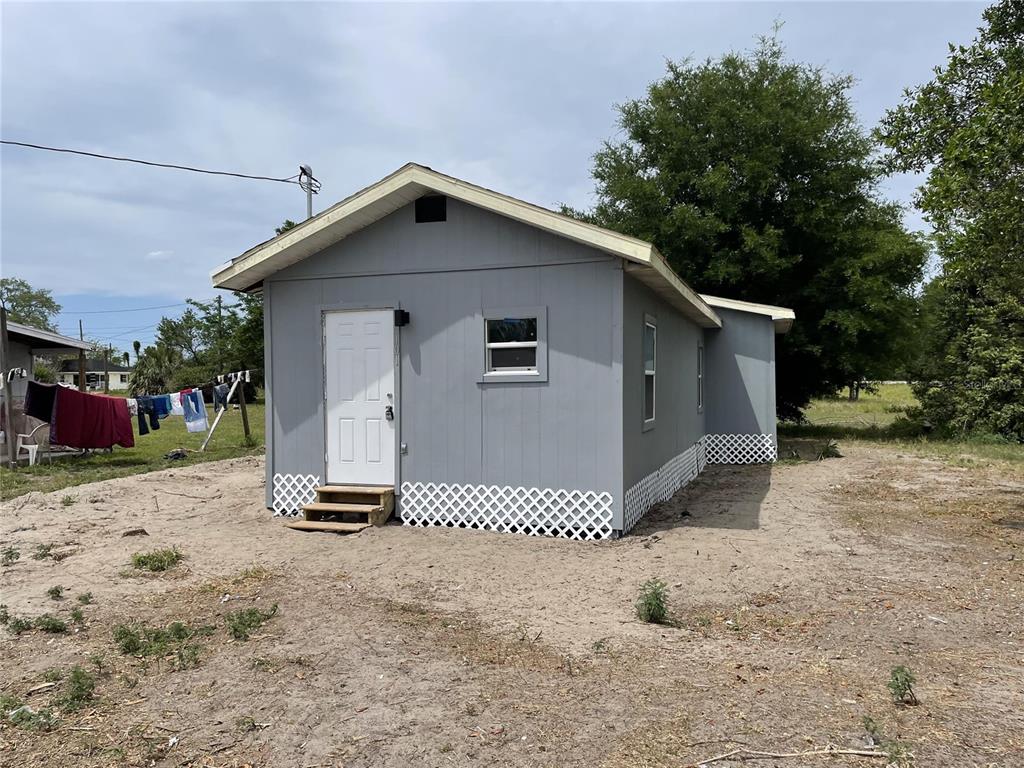 a view of a house with a yard and garage