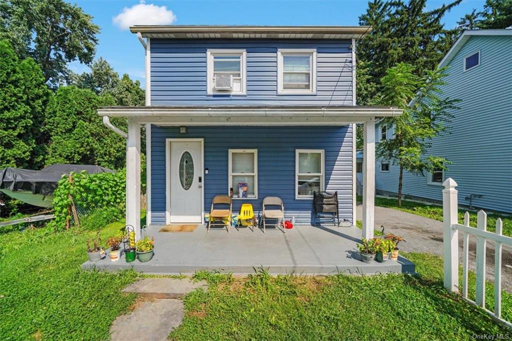 View of front of property featuring covered porch