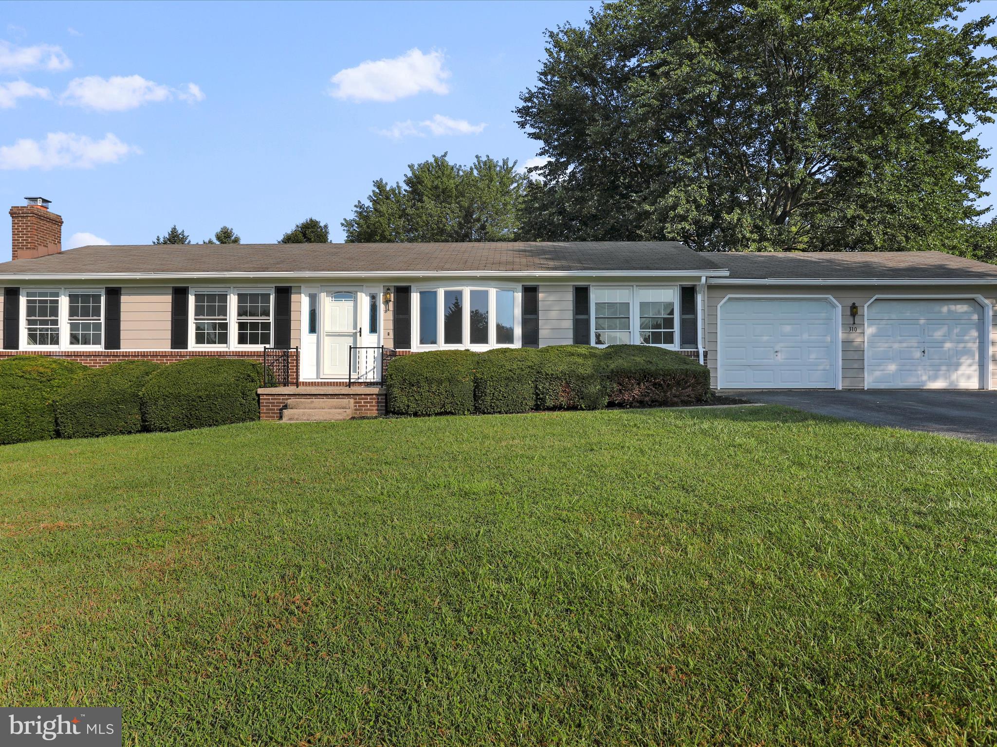 a house view with a garden space