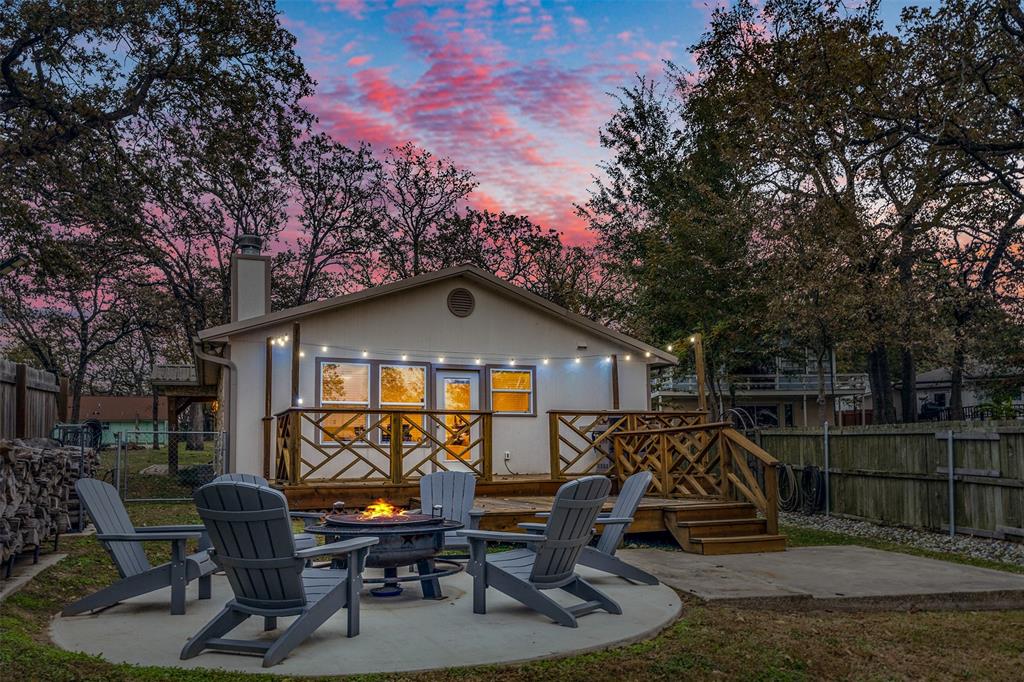 a front view of a house with outdoor seating