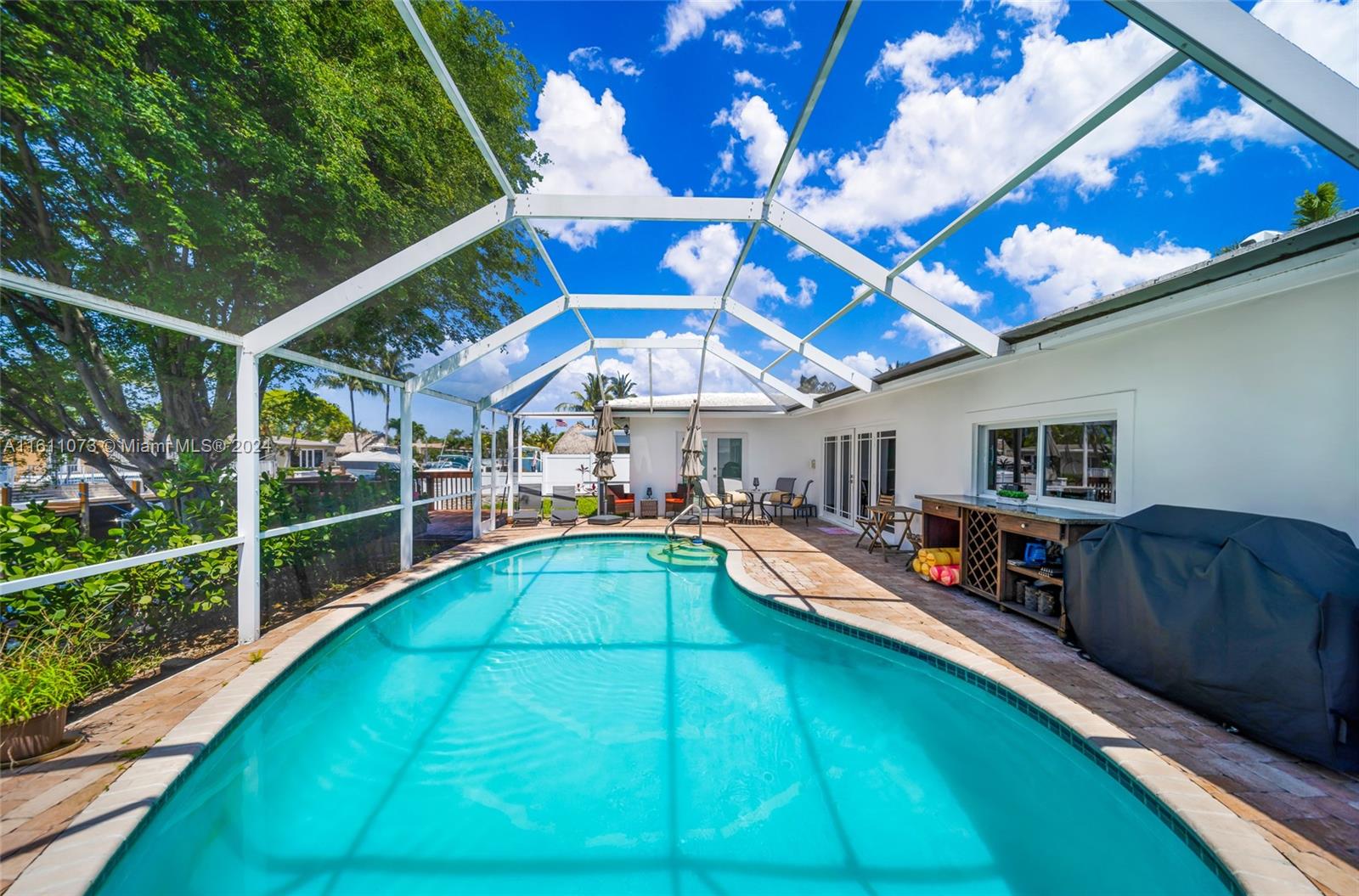 a view of a backyard with a patio and wooden floor