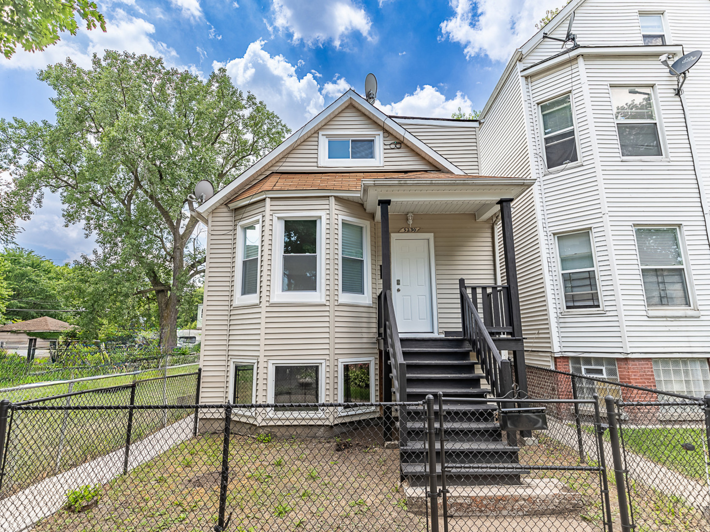 a front view of a house with a porch