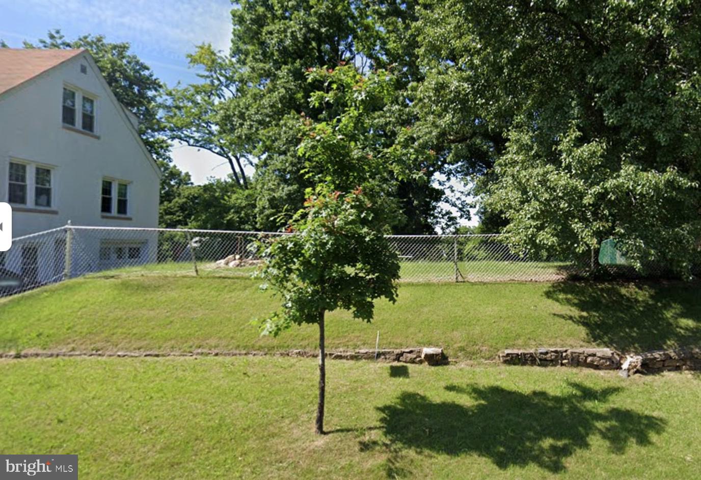 a view of a yard with swimming pool