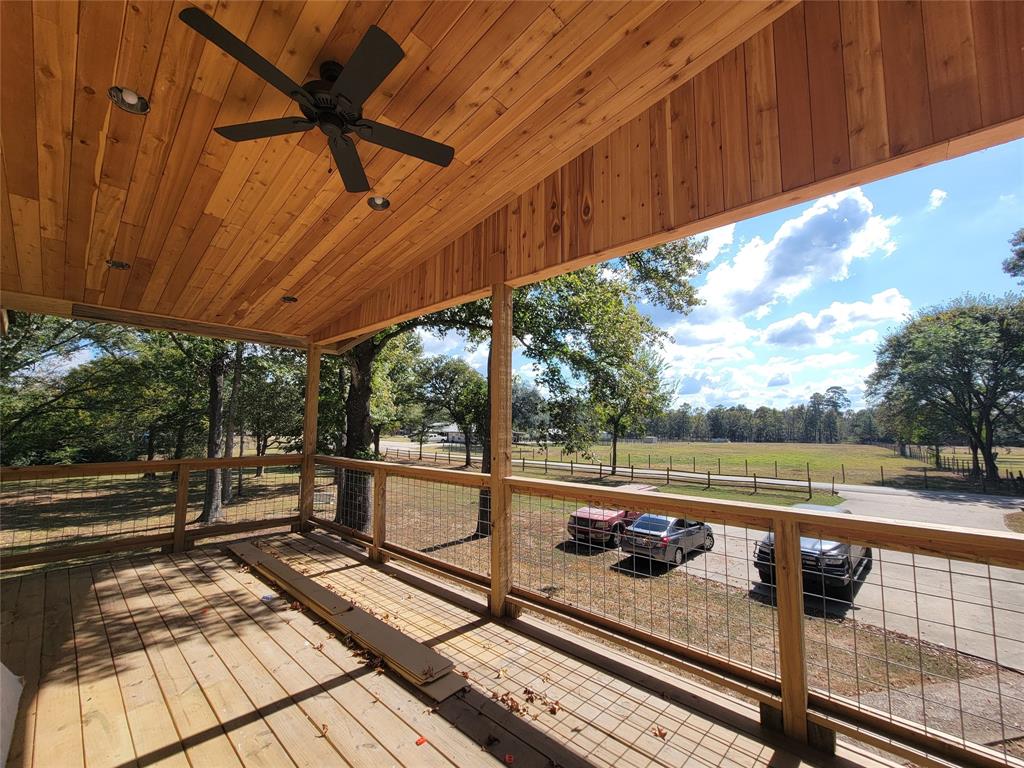 a view of a balcony with wooden floor