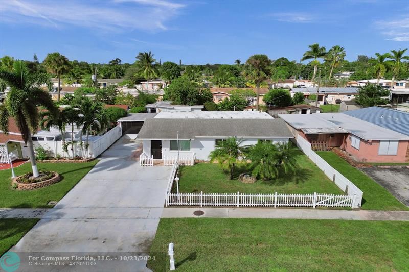 an aerial view of a house with a garden