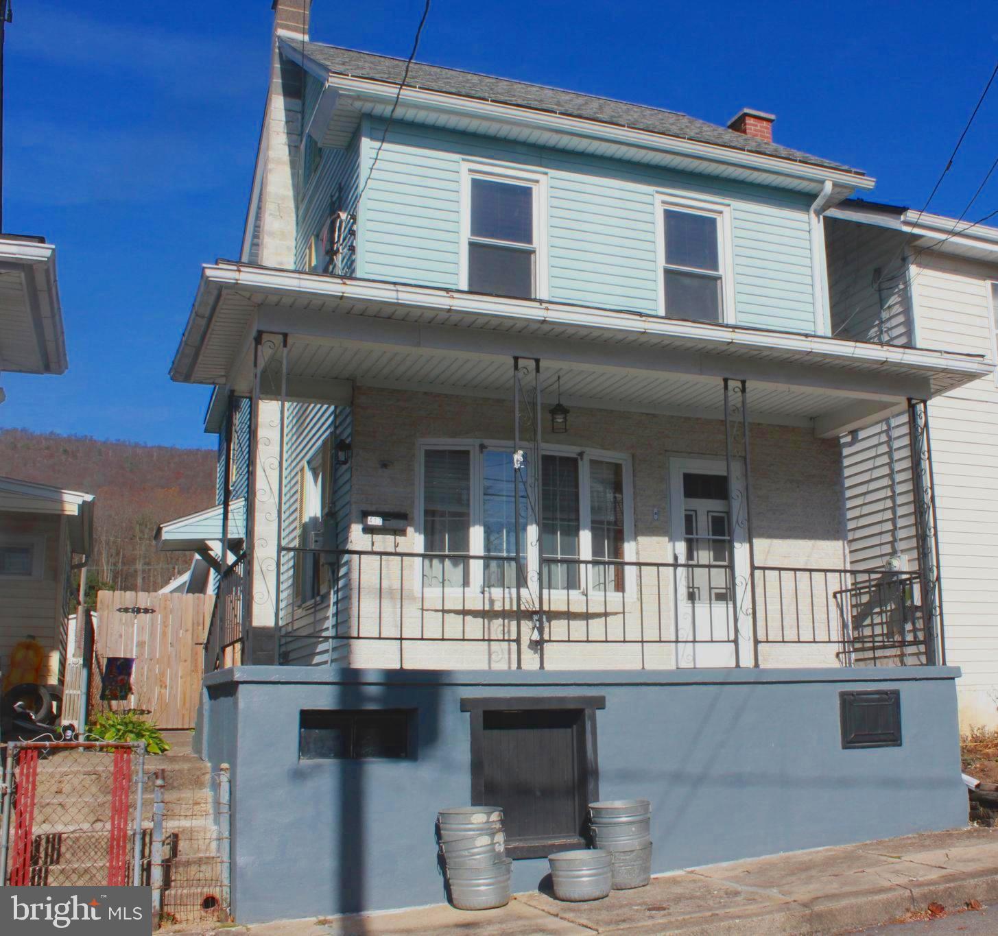 a front view of a house with a porch