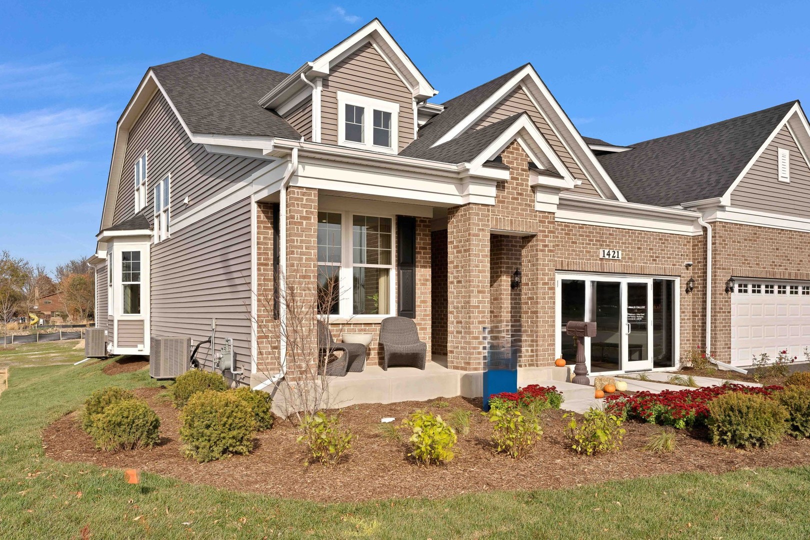 a front view of a house with a yard