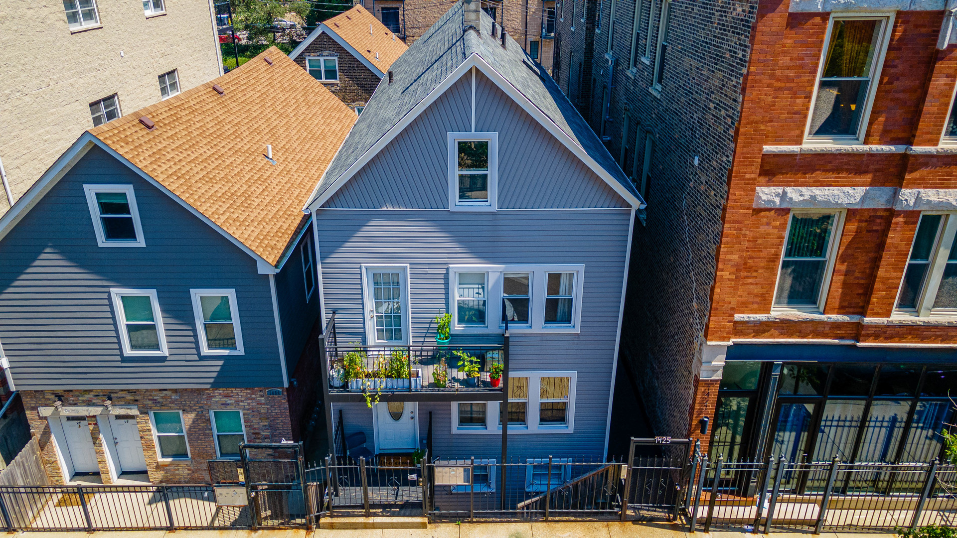 a view of a house with brick walls