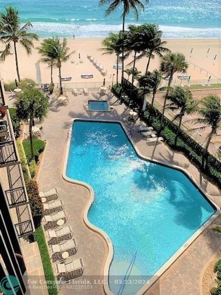 a view of swimming pool from a balcony