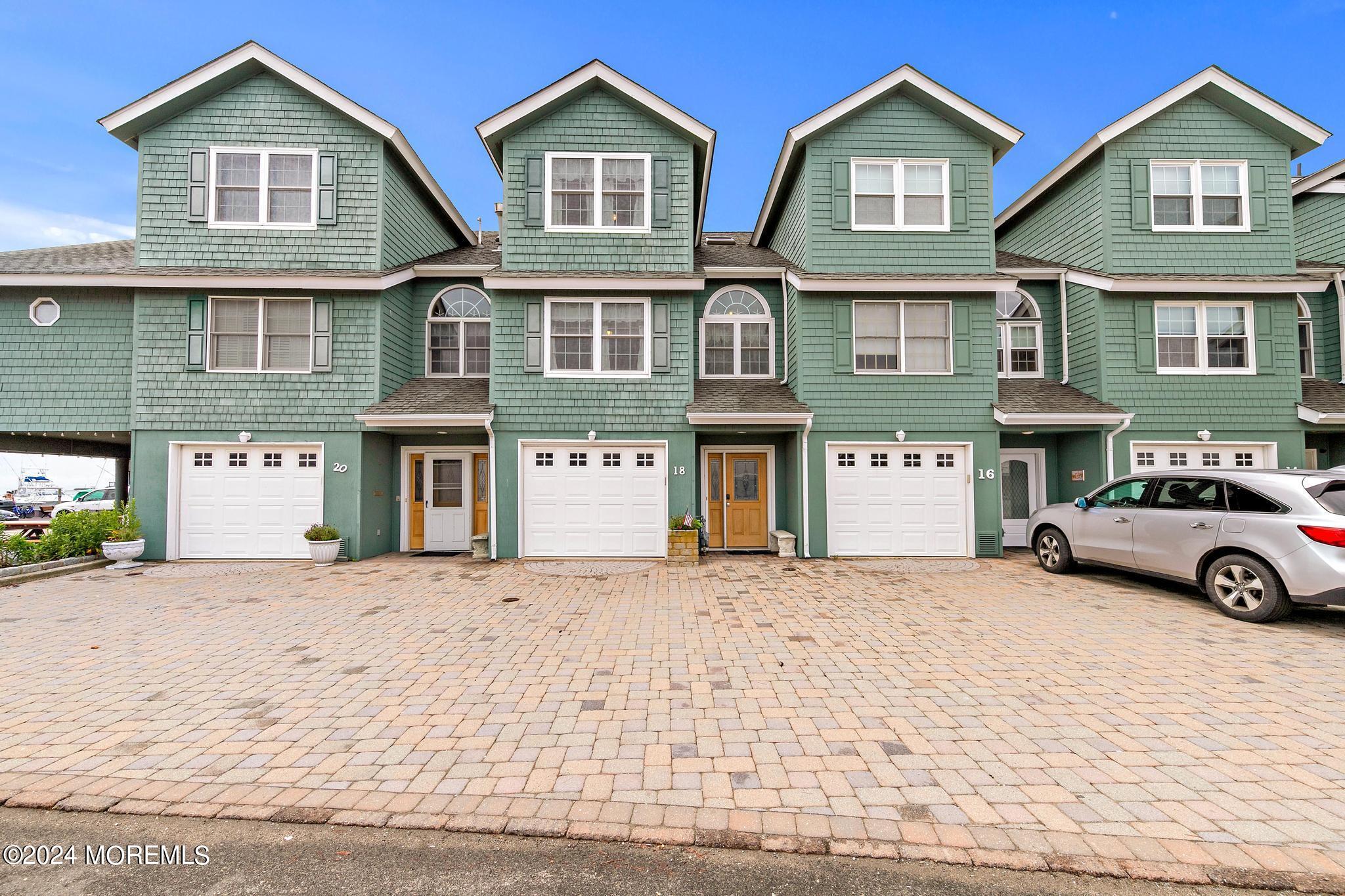 a view of a car parked in front of a brick house