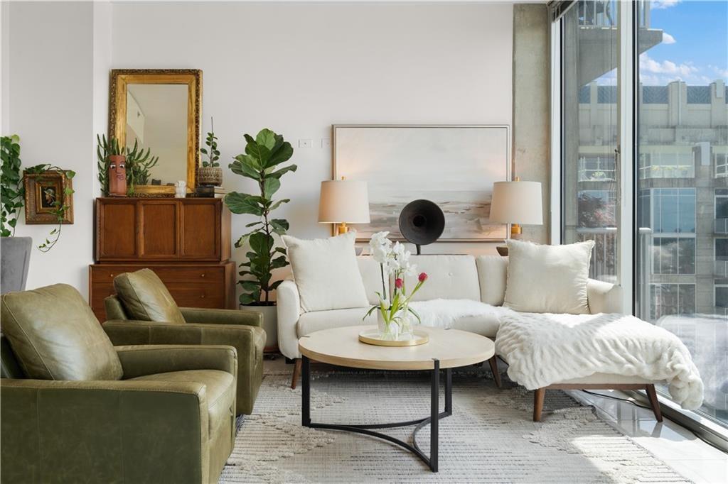 a living room with furniture and a table