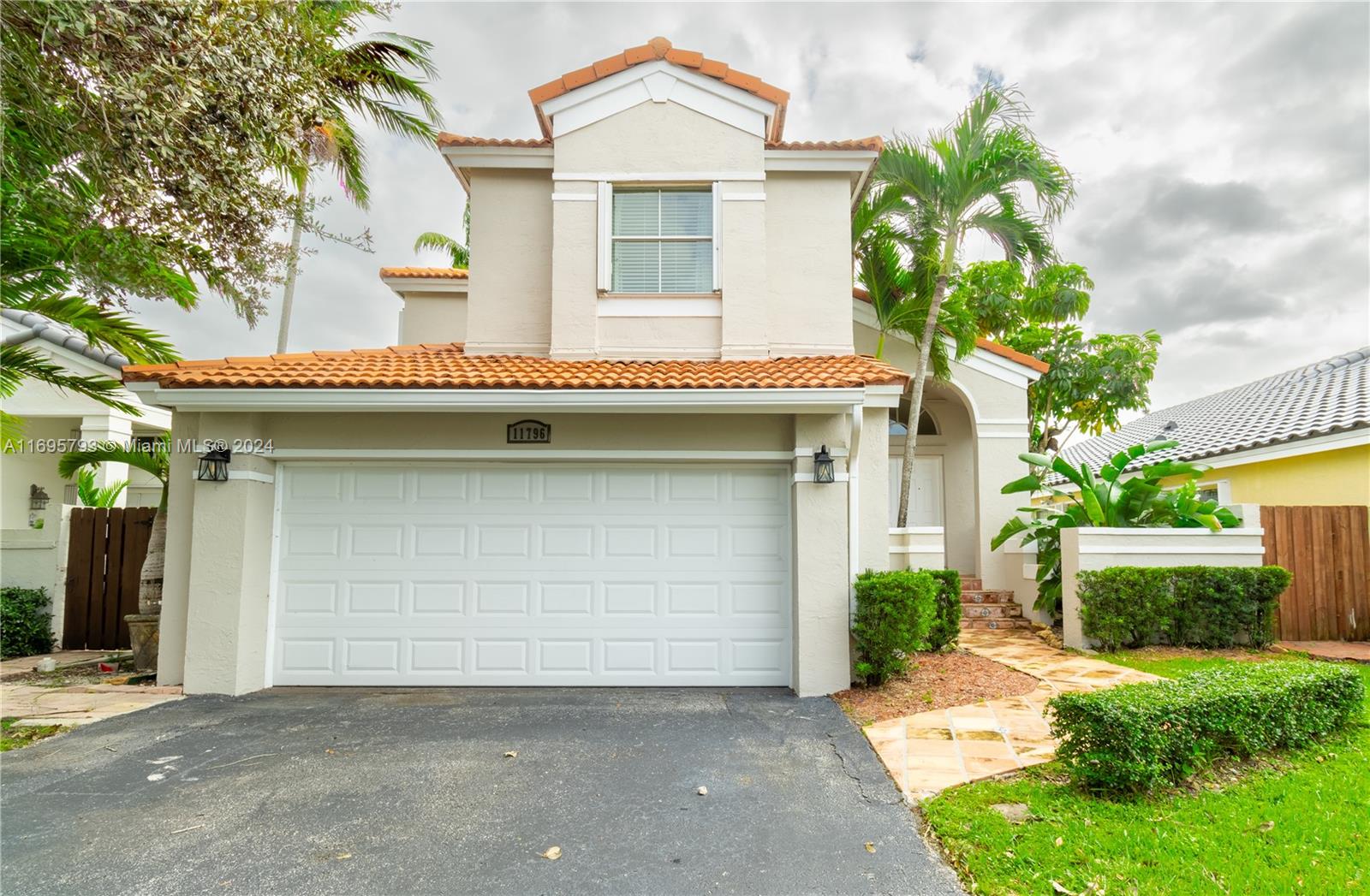 a front view of a house with a garage