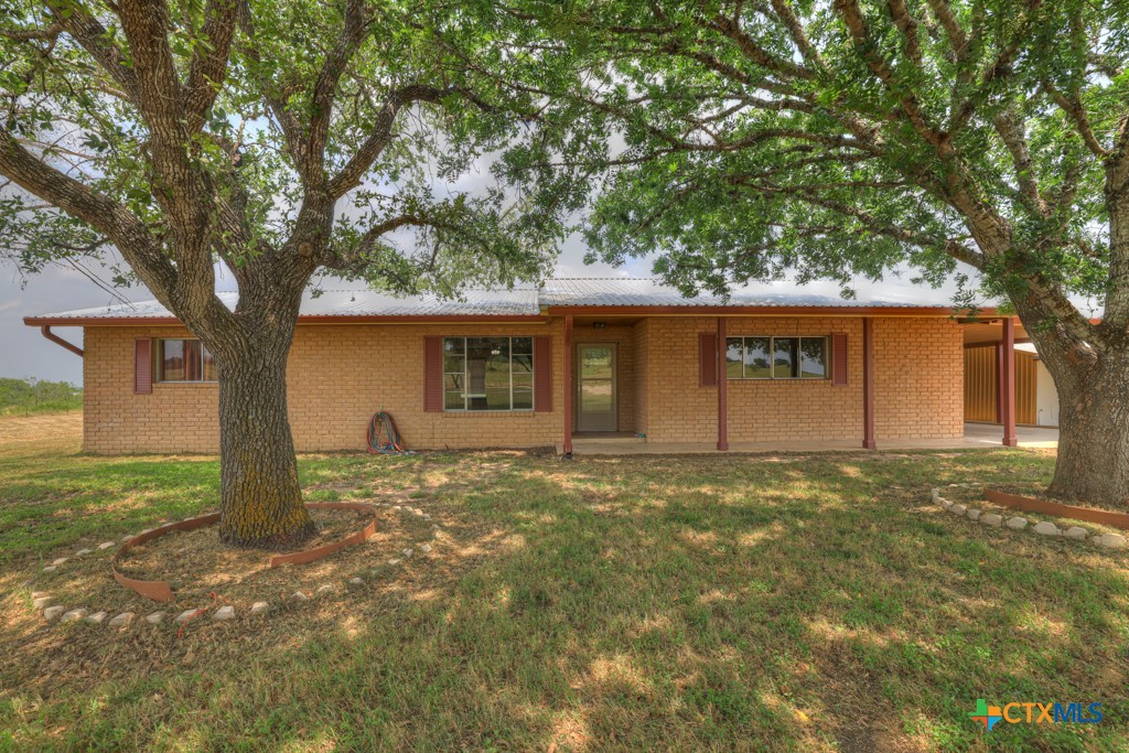 a view of a house with a yard