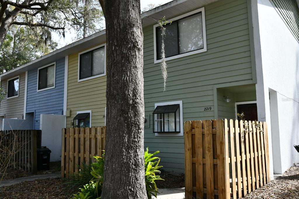 a front view of a house with outdoor seating