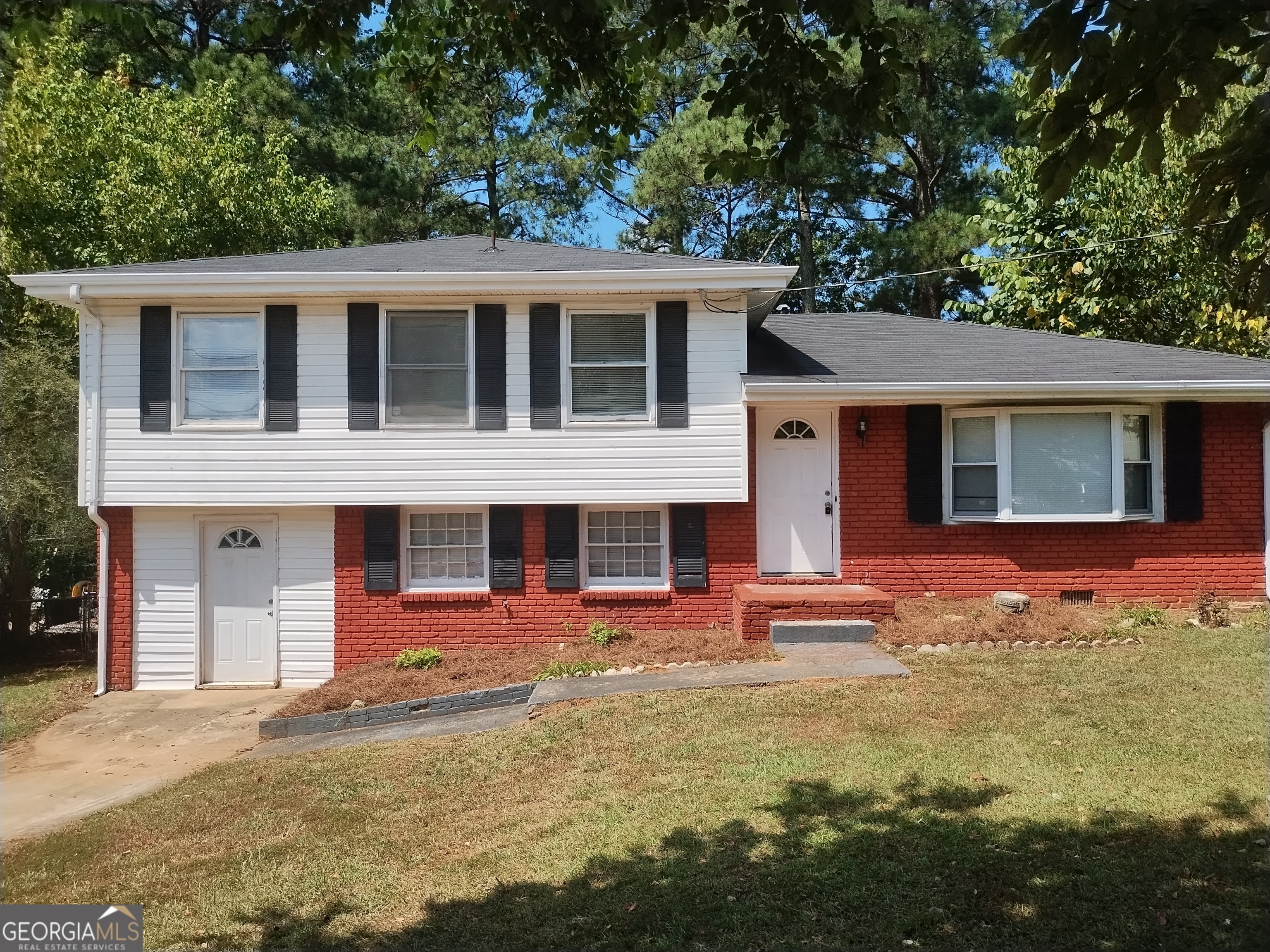 front view of a house with a yard