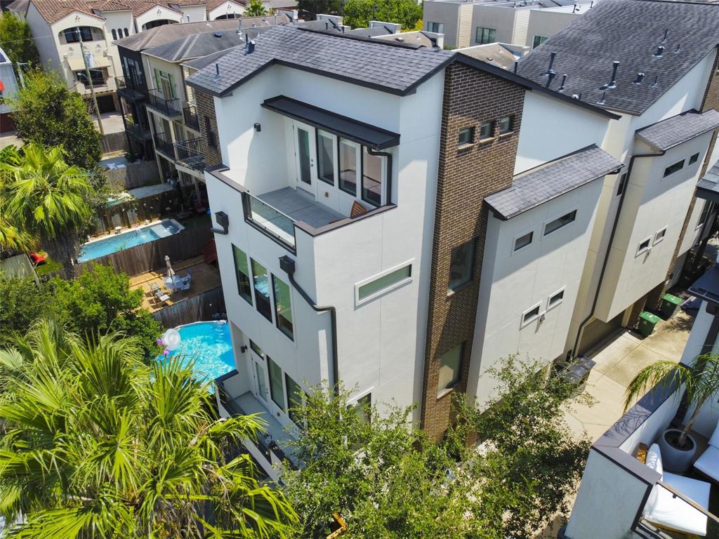 an aerial view of a house with a yard