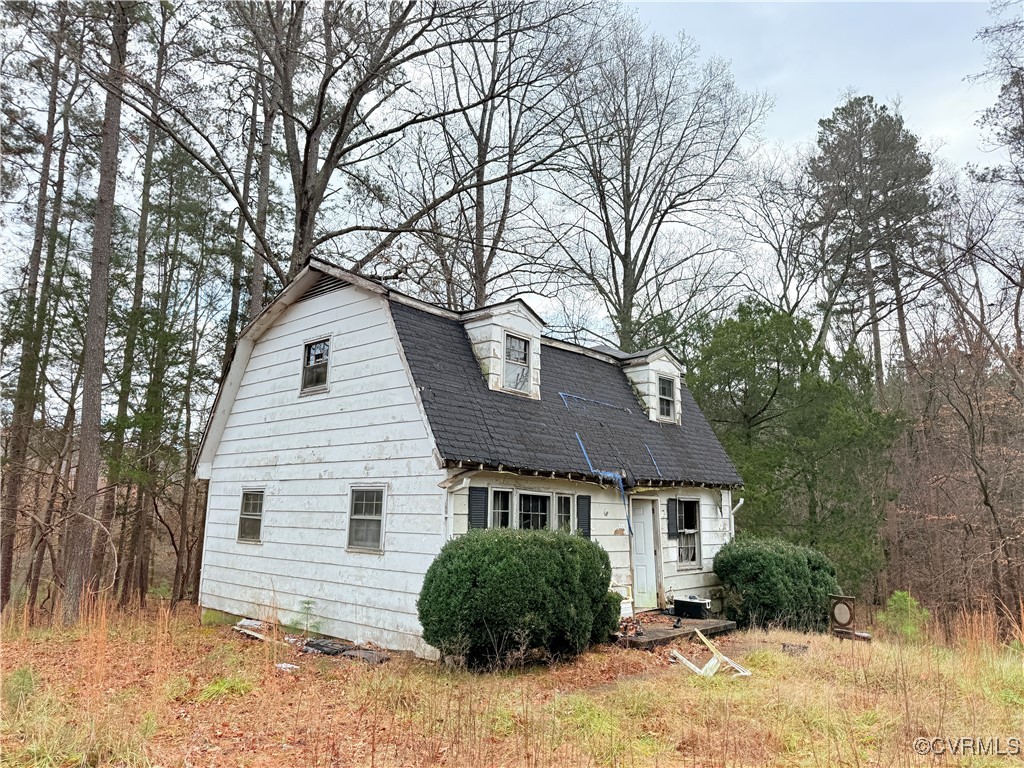 a house that has a tree in front of it