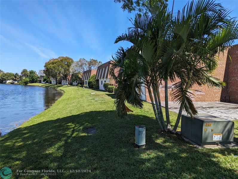 a view of a lake with a big yard