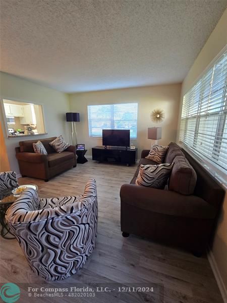 a living room with furniture window and a lamp