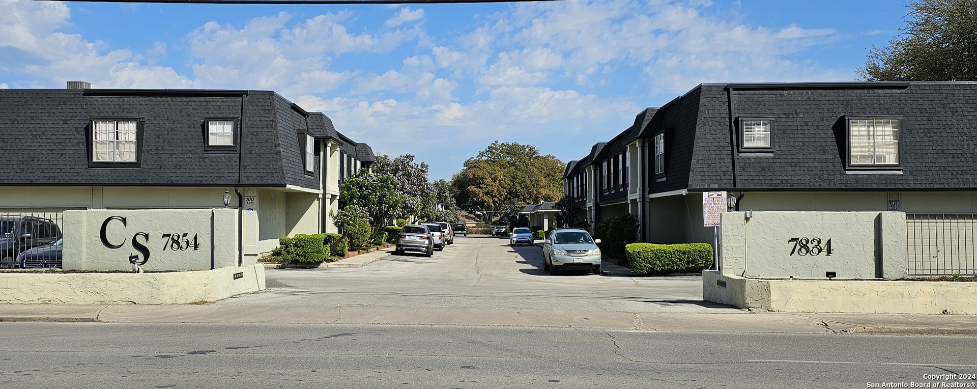 a view of a street with a building in the background